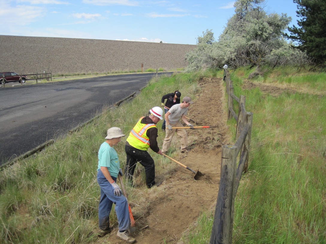 Adopt-A-Trail group performing their trail maintenance at Mill Creek Project.