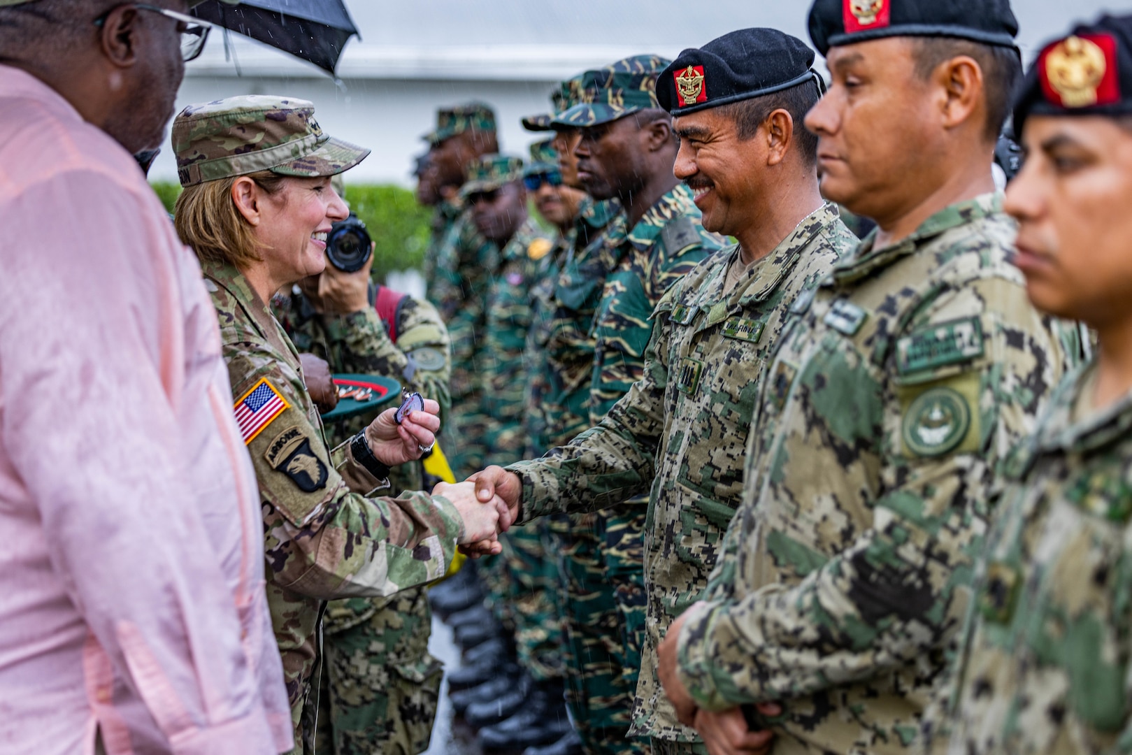 U.S. Southern Command Commanding General, Gen. Laura Richardson (left), shakes the hand of a Mexican Marine paratrooper at an Airborne Wing Exchange ceremony at TRADEWINDS 23 on Camp Stephenson, Guyana, July 26, 2023.