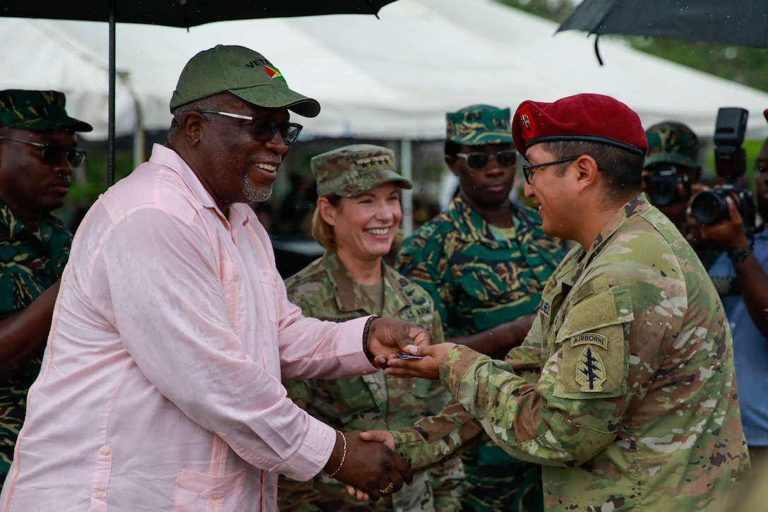 Guyana Prime Minister, Mark Phillips and U.S. Army Gen. Laura Richardson conducted an exchange of jump wings ceremony during distinguished visitor day at Camp Stephenson, Guyana on July 26, 2023.
