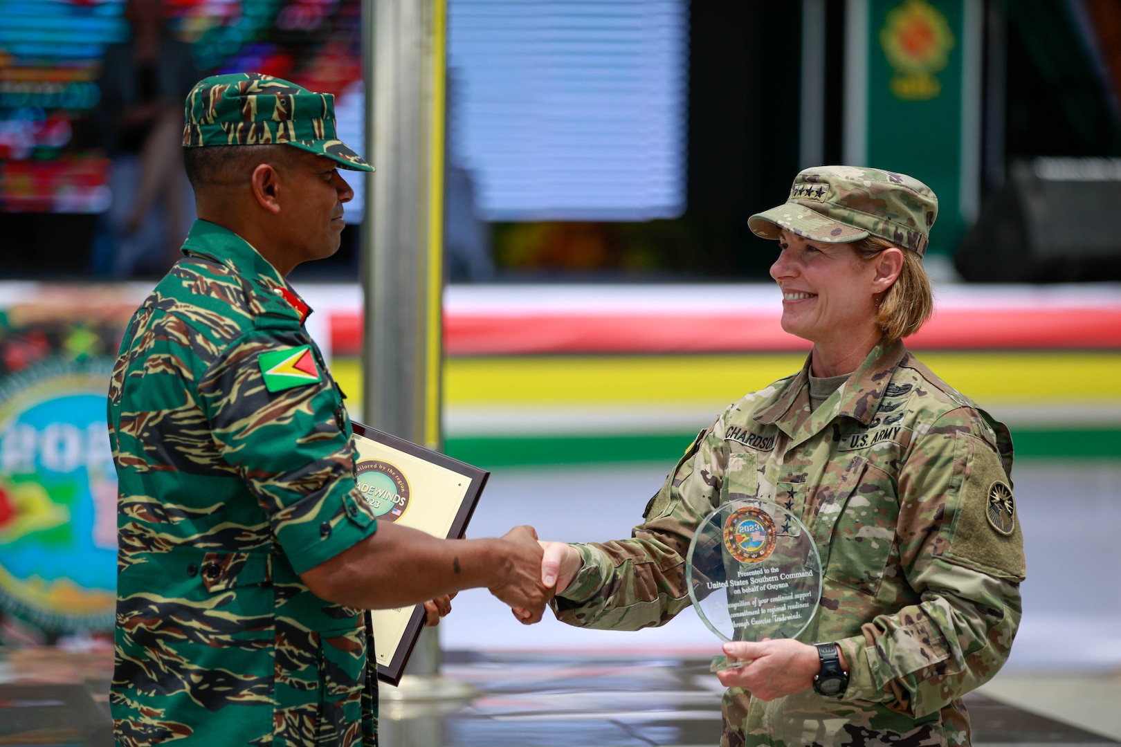 U.S. Army Gen. Laura Richardson, Commander of U.S. Southern Command and Guyana Defense Force (GDF) Brigadier Omar Khan, Chief of Staff of the GDF exchange plaques during the closing ceremony for Tradewinds 2023 at Arthur Chung Conference Centre, Guyana on July 27, 2023.