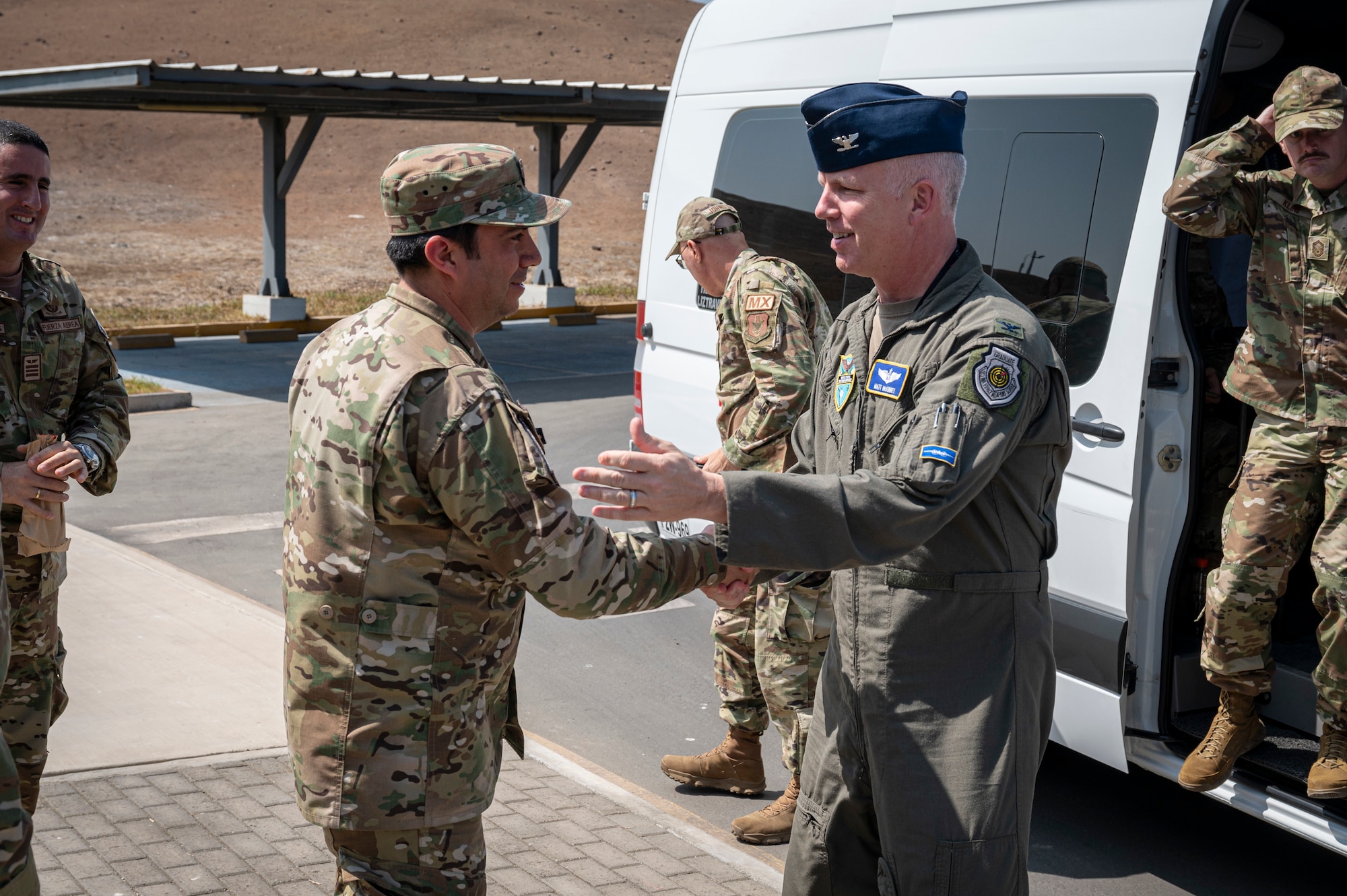 U.S. Air Force Col. Matt McKinney (right), Resolute Sentinel 23 Combined Joint Task Force Commander, and Fuerza Aérea del Perú Lt. Col. Javier Ildefonso, RS23 Space Operations Center Commander, shake hands during a tour at the Centro Nacional de Operaciones de Imágenes Satelitales, Lima, Peru, July 4, 2023, as part of Resolute Sentinel 23. The space exercise, led by U.S. Southern Command in partnership with U.S. Space Command’s Joint Task Force Space Defense Commercial Operations (JCO) Cell, the Peruvian Aerospace Research and Development Center (CONIDA), and the Peruvian Air Force, aims to bolster the region's emerging space programs.  (U.S. Air Force photo by Staff Sgt. Matthew Matlock)
