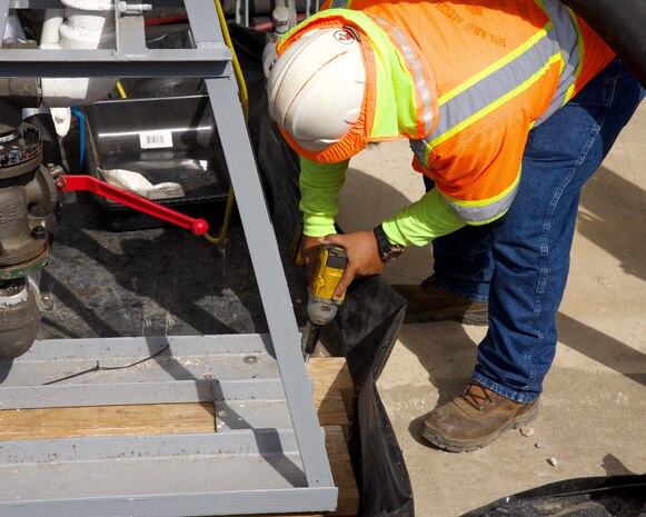 Civilian personnel assigned to Joint Task Force-Red Hill (JTF-RH) secure a fuel pump in preparation for draining the surge tanks at the Red Hill Bulk Fuel Storage Facility (RHBFSF) on Joint Base Pearl Harbor-Hickam, Honolulu, Hawaii, July 25, 2023. JTF-RH is in phase three of its five-phase defueling plan. Personnel are focused on completing quality control tasks, training, response preparation, the National Environmental Policy Act Environmental Assessment, regulatory approvals and operational planning for all future major milestones. This extensive preparatory work will help ensure the safe and expeditious defueling of the RHBFSF. (DoD photo by U.S. Marine Corps Cpl. Gabrielle Zagorski)