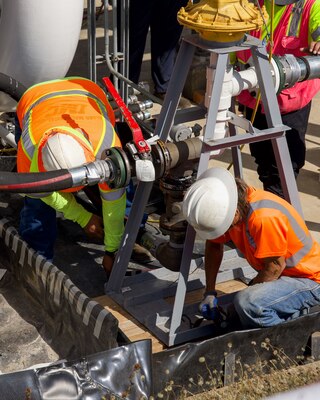 Civilian personnel assigned to Joint Task Force-Red Hill (JTF-RH) secure a fuel pump in preparation for draining the surge tanks at the Red Hill Bulk Fuel Storage Facility (RHBFSF) on Joint Base Pearl Harbor-Hickam, Honolulu, Hawaii, July 25, 2023. JTF-RH is in phase three of its five-phase defueling plan. Personnel are focused on completing quality control tasks, training, response preparation, the National Environmental Policy Act Environmental Assessment, regulatory approvals and operational planning for all future major milestones. This extensive preparatory work will help ensure the safe and expeditious defueling of the RHBFSF. (DoD photo by U.S. Marine Corps Cpl. Gabrielle Zagorski)