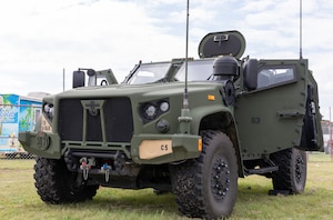 A M1280 Joint Light Tactical Vehicle sits by Lake Afton in Afton, Kansas, July 21, 2023. The 1st Infantry Division attended the Dam Jam Music Festival to assist the U.S. Army with recruitment efforts in the region (U.S. Army photo by Spc. Steven Johnson)