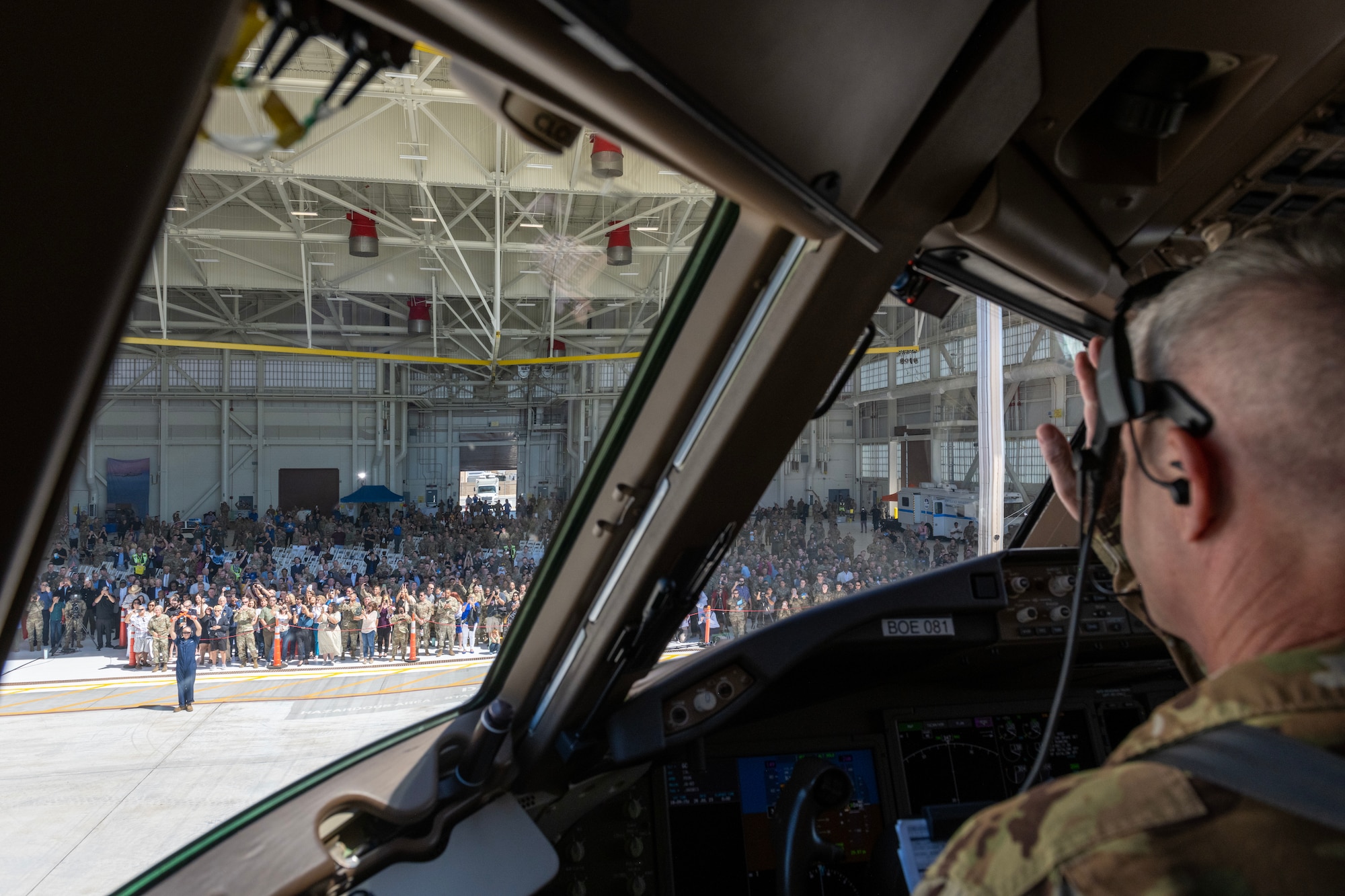 a general waves at a crowd