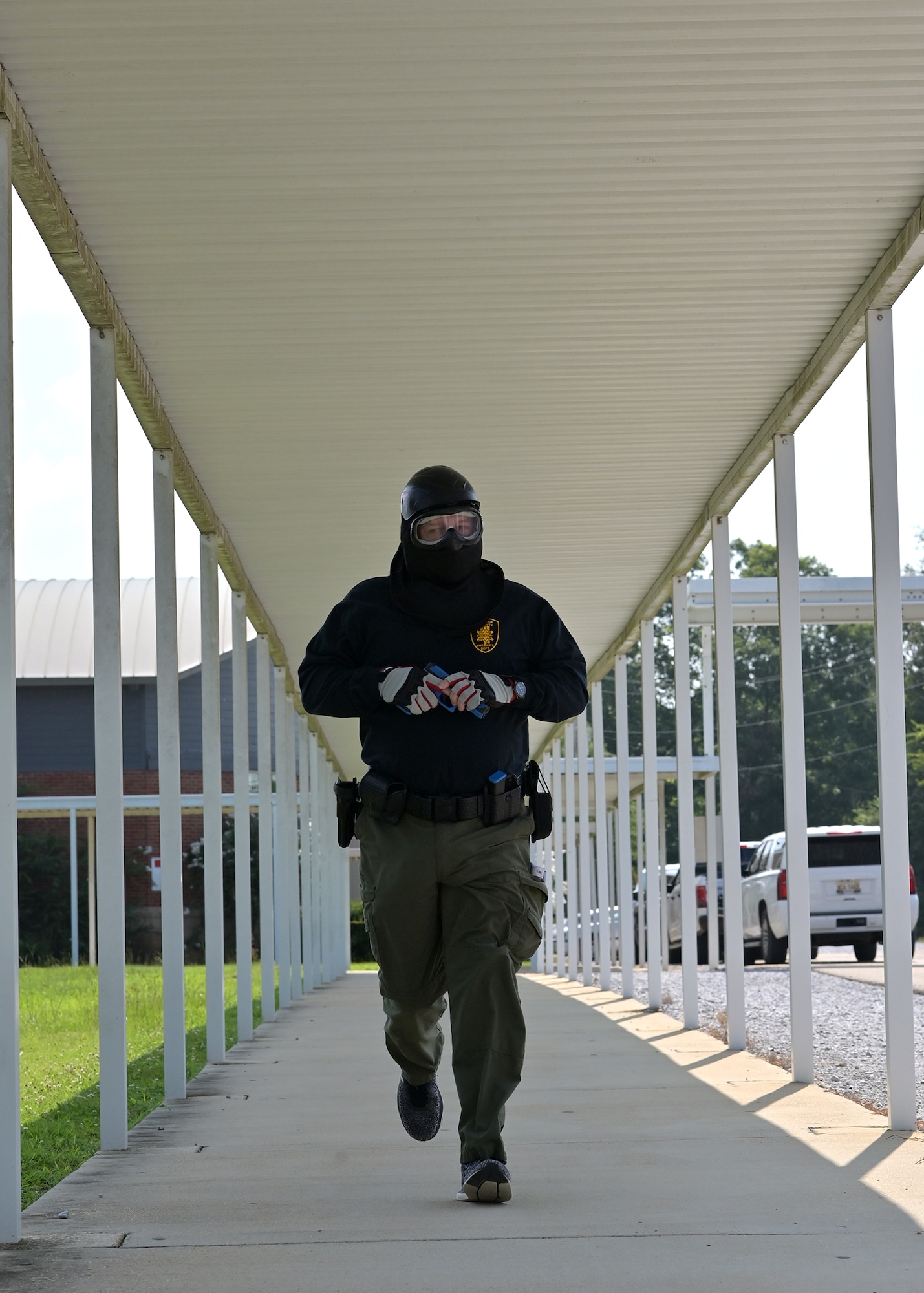 An ALERRT participant runs to engage a simulated active shooter.