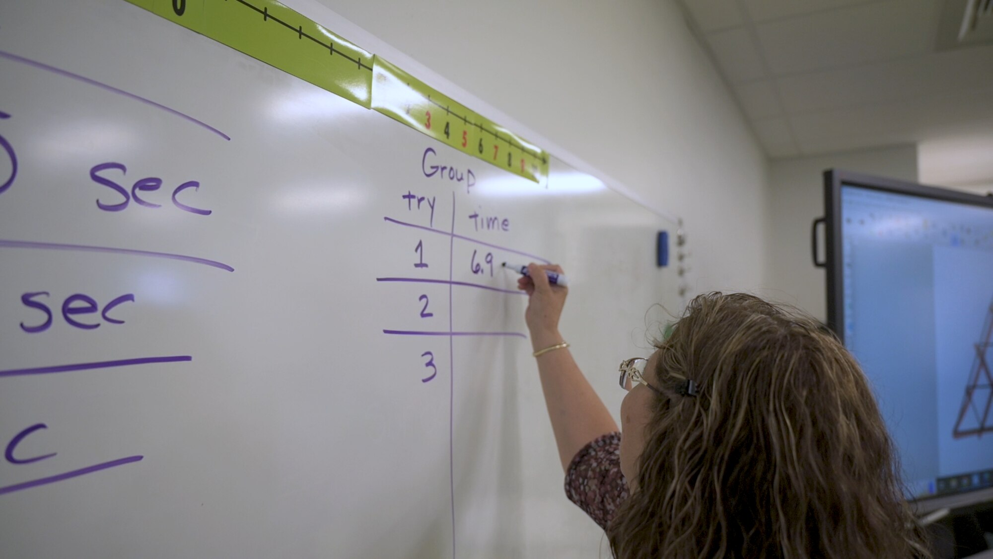 Anna- Marie Leon, PRIME instructor, writes math problems on the board during a PRIME lesson. Edwards AFB's PRIME outreach program wrapped up yet another successful year leaving a trail of motivated and inspired students ready to take on the world of science, technology, engineering and mathematics.