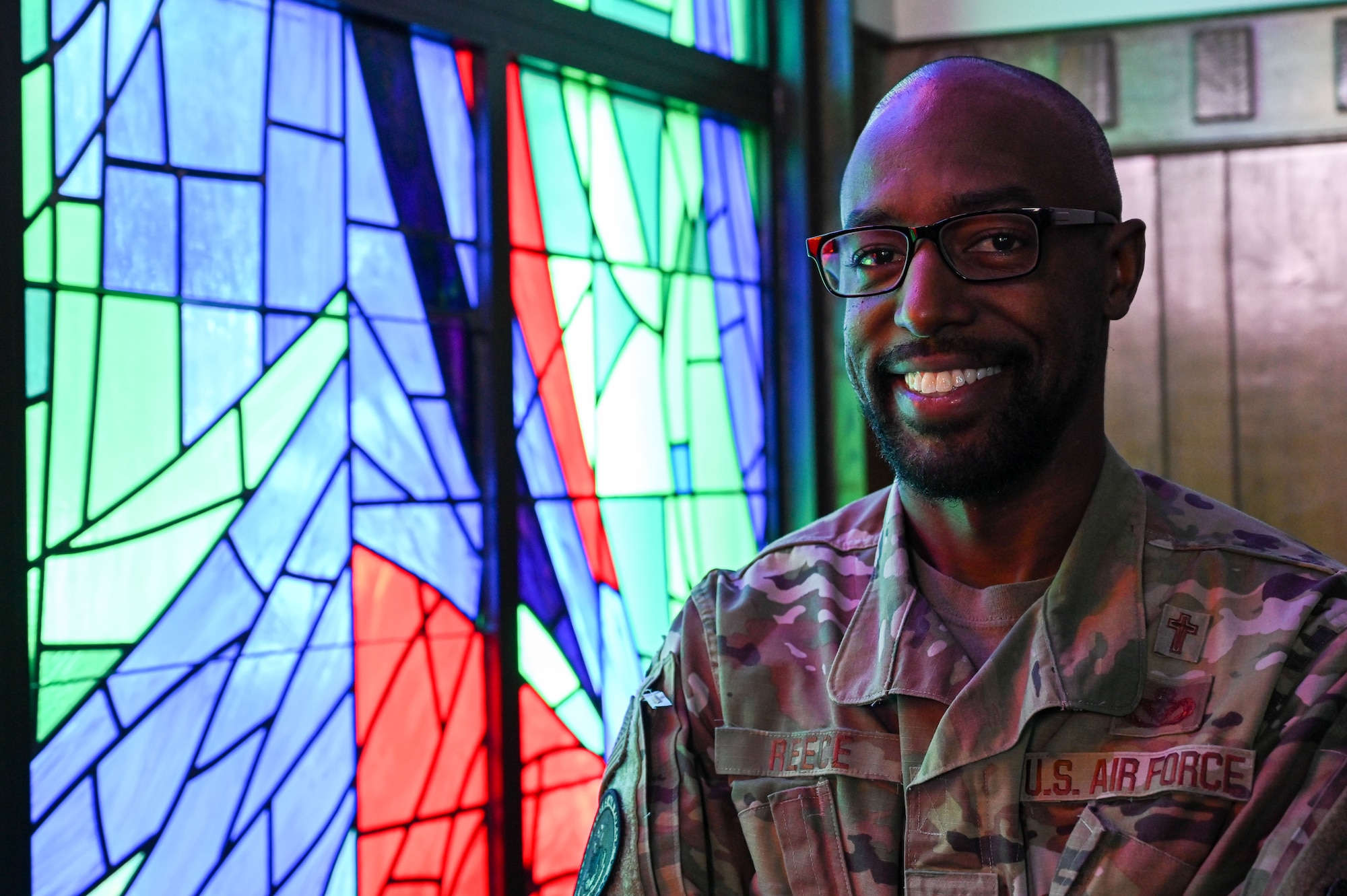 U.S. Air Force Capt. Lamar Reece, 97th Air Mobility Wing deputy chaplain, poses for a photo at the Chapel at Altus Air Force Base, Oklahoma, July 24, 2023. Reece served nine years as enlisted before commissioning as a chaplain. (U.S. Air Force photo by Senior Airman Kayla Christenson)
