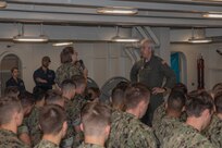 Midshipmen listen to Rear Adm. John Meier