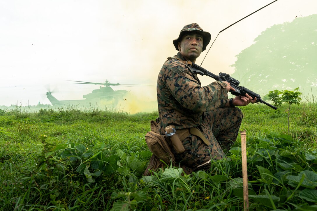 U.S. Marines Corps 1st Lt. David Powell, an assault amphibian vehicle commander with 4th Amphibious Assault Battalion, 4th Marine Division, guards the perimeter of a UH-1Y Venom landing zone during riverine operations training on the Río Sinú during UNITAS LXIV near Base de Entrenamiento de Infantería de Marina in Coveñas, Colombia, July 14, 2023. Through event-driven scenarios, UNITAS provides unique training opportunities both at sea and ashore in challenging and uncertain environments to conduct joint maritime operations through the execution of surface, air, amphibious and electronic warfare operations that enhance warfighting proficiency and increase interoperability among participating naval and marine forces.