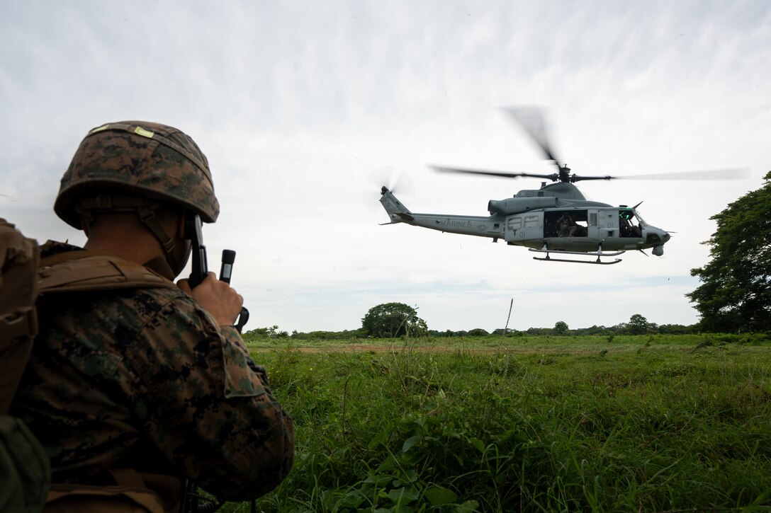 U.S. Marine Corps Cpl. Justin Velez, an assault amphibious vehicle crewman with 4th Amphibious Assault Battalion, 4th Marine Division, guards the perimeter of a UH-1Y Venom landing zone during riverine operations training on the Río Sinú during UNITAS LXIV near Base de Entrenamiento de Infantería de Marina in Coveñas, Colombia, July 14, 2023. Through event-driven scenarios, UNITAS provides unique training opportunities both at sea and ashore in challenging and uncertain environments to conduct joint maritime operations through the execution of surface, air, amphibious and electronic warfare operations that enhance warfighting proficiency and increase interoperability among participating naval and marine forces.