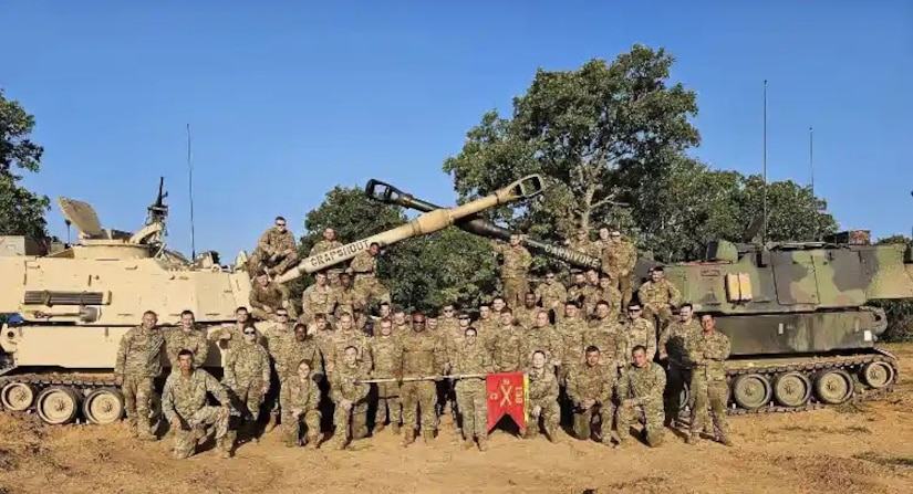 Soldiers of Charlie Battery gather for a unit photo after conclusion of the Top Gunner competition, in which they won during their Exportable Combat Training Capabilities exercise June 16-30. (