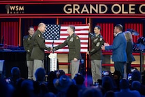 man wearing army uniform on stage