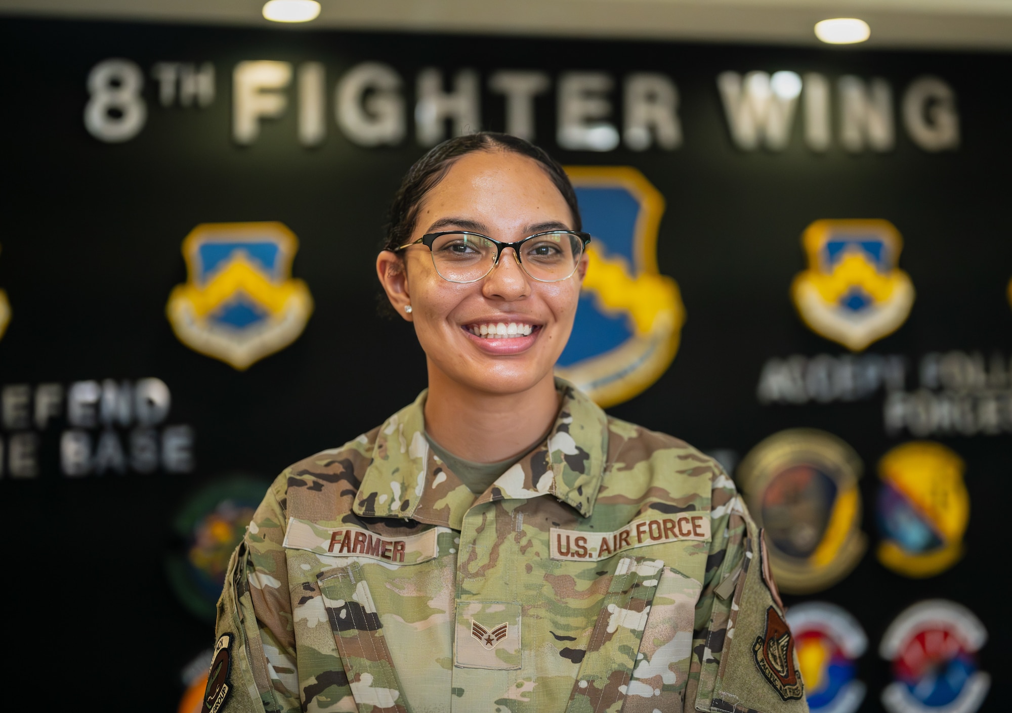 Senior Airman Jasmyn Farmer poses for a photo after winning the Pride of the Pack award.