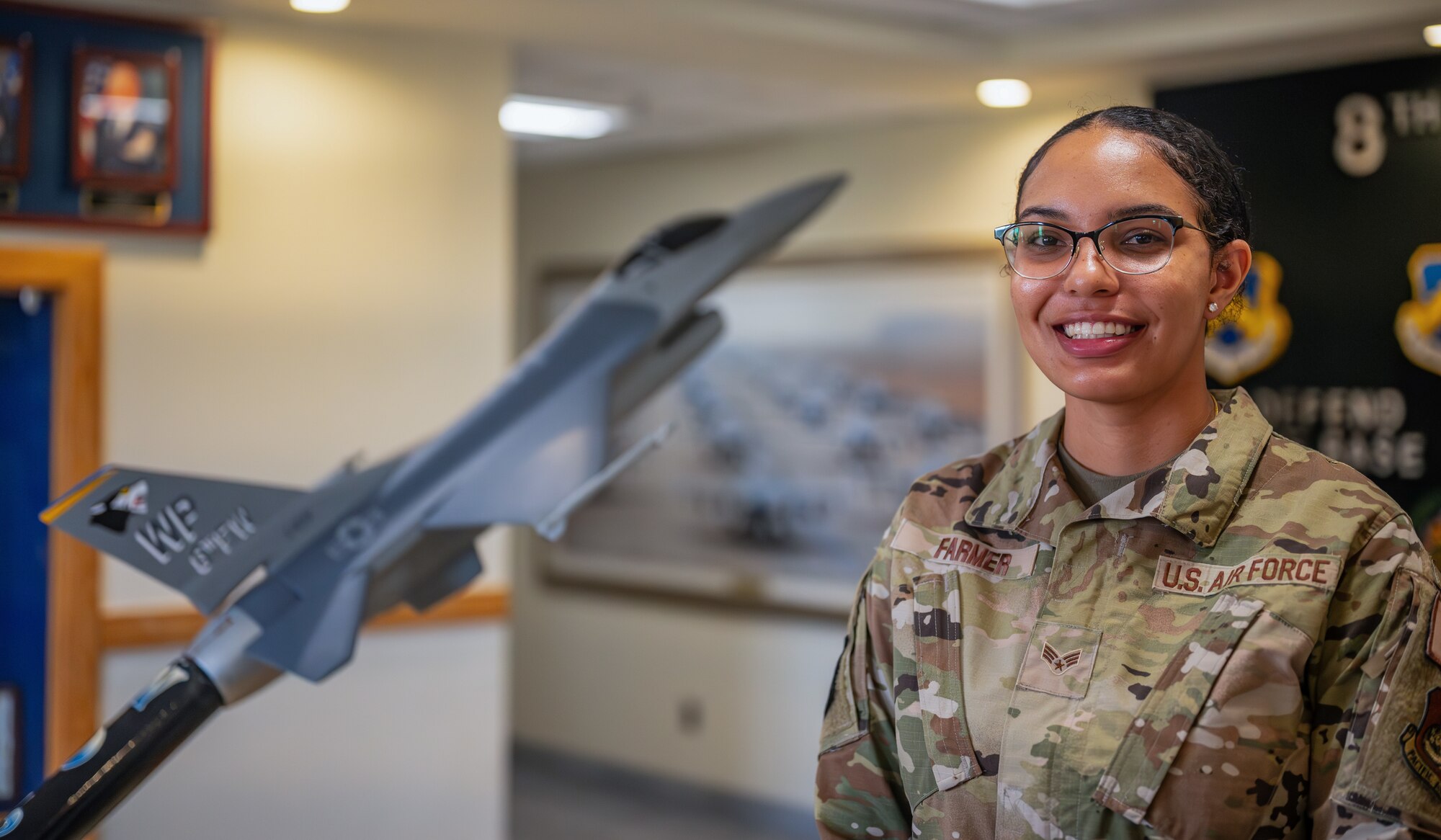 Senior Airman Jasmyn Farmer poses for a photo after winning the Pride of the Pack award.