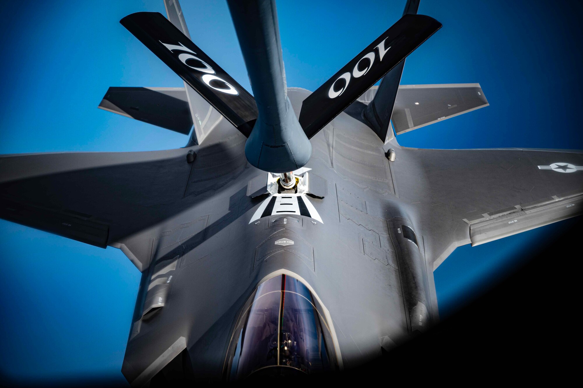 A U.S. Air Force F-35A Lightning II aircraft assigned to the 388th Fighter Wing, Hill Air Force Base, Utah, receives aerial refueling via a KC-135 Stratotanker aircraft from the 100th Air Refueling Wing, Royal Air Force Mildenhall, England, during a coronet line over the mediterranean, July 25, 2023.
