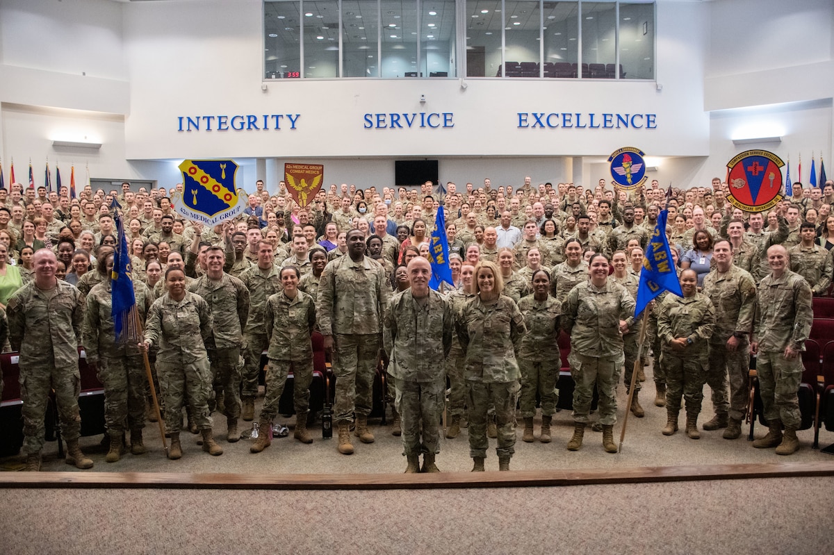 Airmen from the 42nd Medical Group and Officer Training School cadets pose for a group photo at Maxwell Air Force Base, Alabama, July 19, 2023. Lt. Gen. Robert I. Miller, Air and Space Forces surgeon general (front left), and Chief Master Sgt. Dawn M. Kolczynski, medical enlisted force and enlisted corps chief for the Office of the Air Force Surgeon General (front right), visited the 42nd Medical Group, OTS and Air Force ROTC Headquarters.