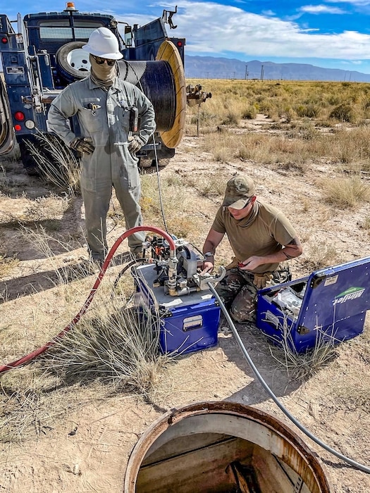 85th Engineering Installation Squadron Airmen install cable through a jetted fiber system in support of Operation Allied Welcome.