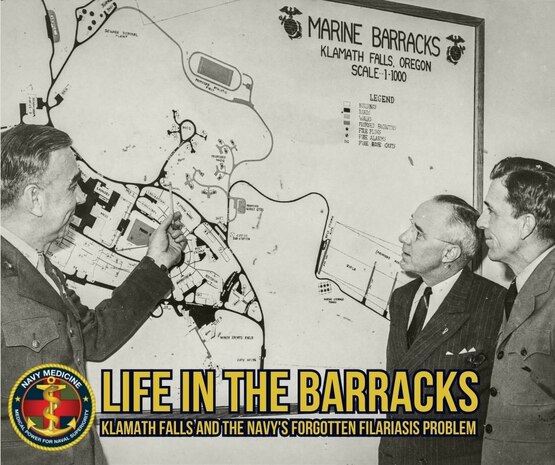 CAPTION. Officials discuss layout of the Marine Barracks at Klamath Falls, 1944. Cmdr. Lowell Coggeshall, the Chief Medical Officer of the “Barracks,” is standing on the right. From 1944 to 1946, the Marine Barracks served as a rehabilitation facilities for Pacific War veterans with filariasis and relapsing malaria. Courtesy of Oregon Historical Society