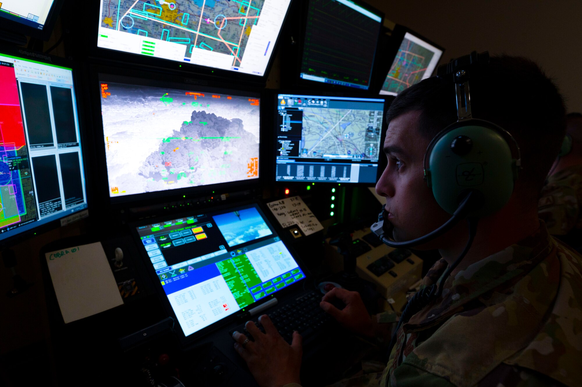 U.S. Air Force 2nd Lt. Loftus, 491st Attack Squadron student pilot, is seen monitoring and piloting an MQ-9 Reaper in a ground control station at Hancock Field Air National Guard Base, New York, June 27, 2023. The 491st ATKS instructors train MQ-9 student pilots and sensor operators in real-world combat scenarios that will be present in operational environments. (U.S. Air Force photo by Airman 1st Class Isaiah Pedrazzini)