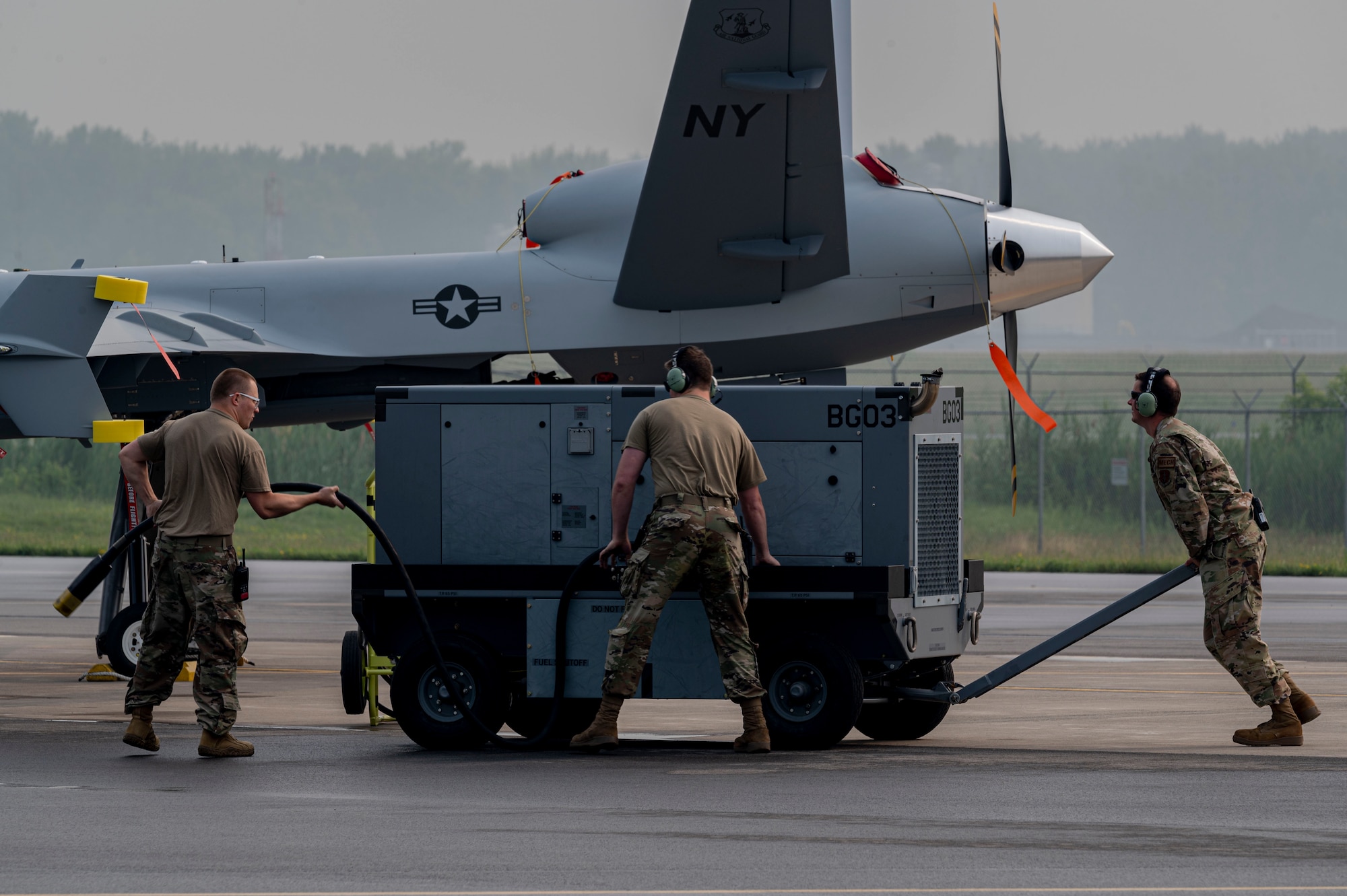 Airmen From the 491st Attack Squadron and 174th Attack Wing prepare to fuel an MQ-9 Reaper at Hancock Field Air National Guard Base, New York, June 29, 2023.The 491st ATKS is composed of both active duty and Air National Guard personnel responsible for training student pilots and sensor operators how to operate an MQ-9 Reaper. (U.S. Air Force photo by Airman 1st Class Isaiah Pedrazzini)
