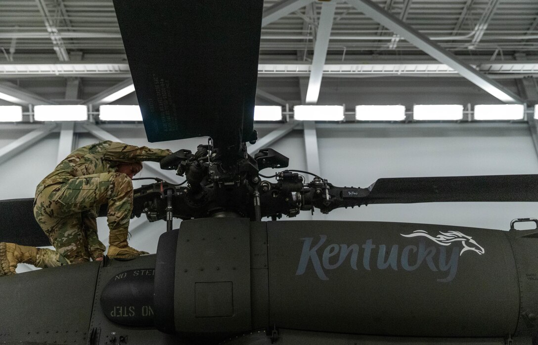 U.S. Army 1st Lt. Cassandra Frederick, platoon leader and UH-60 Black Hawk pilot assigned to Bravo Company, 2/147th Assault Helicopter Battalion, inspects the rotors of a UH-60 Black Hawk on Boone National Guard Center in Frankfort, Ky., July 27, 2023