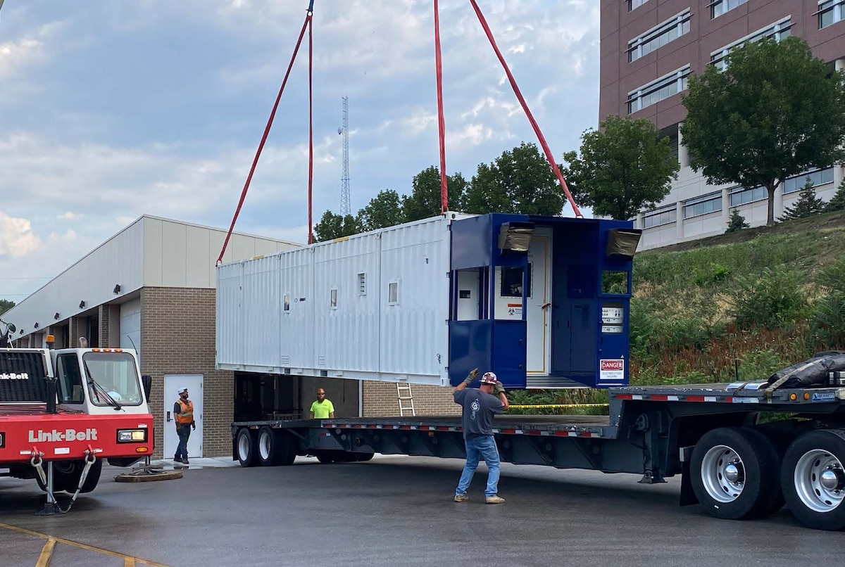 The Negatively Pressurized CONEX, or NPC, arrives at the Center for Sustainment of Trauma and Readiness Skills, or C-STARS, in Omaha, Nebraska June 24, 2023. The NPC will be used in developing a new infectious disease air transport training course on procedures for current and future outbreaks of highly infectious disease (U.S. Air Force photo / Dr. Chris Kratochvil).