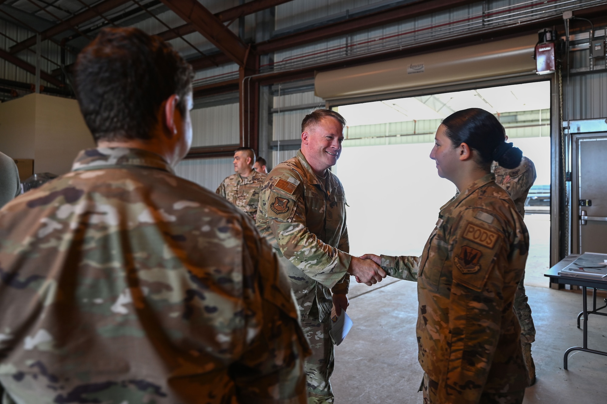 U.S. Air Force Chief Master Sgt. William Cupp, 350th Spectrum Warfare Wing command chief, meets Airmen from the 36th Electronic Warfare Squadron at Eglin Air Force Base, Fla., July 31, 2023. Cupp has a diverse experience across the aircraft maintenance, operations, and agile combat support fields. (U.S. Air Force photo by Staff Sgt. Ericka A. Woolever)