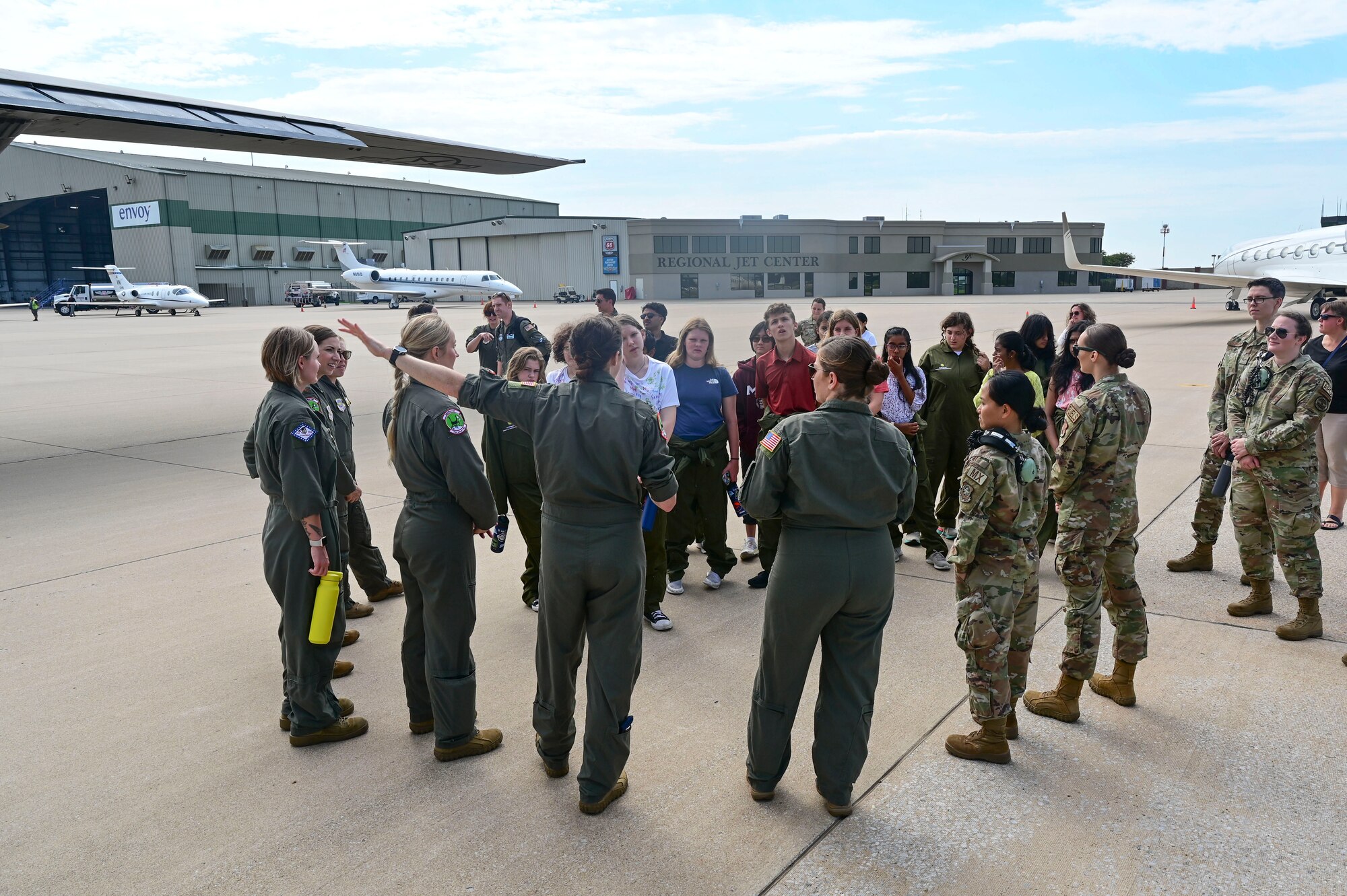 Service members speak to students.