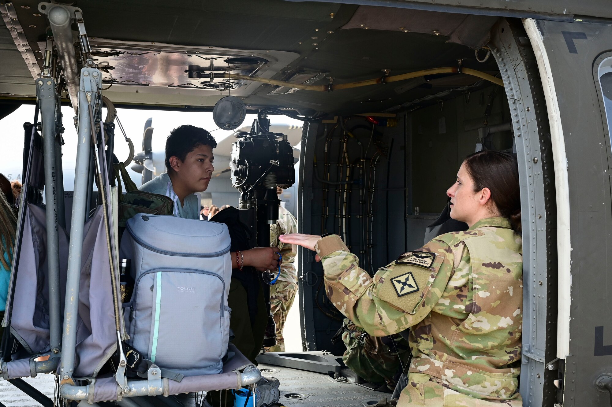 A child sits in a helicopter.
