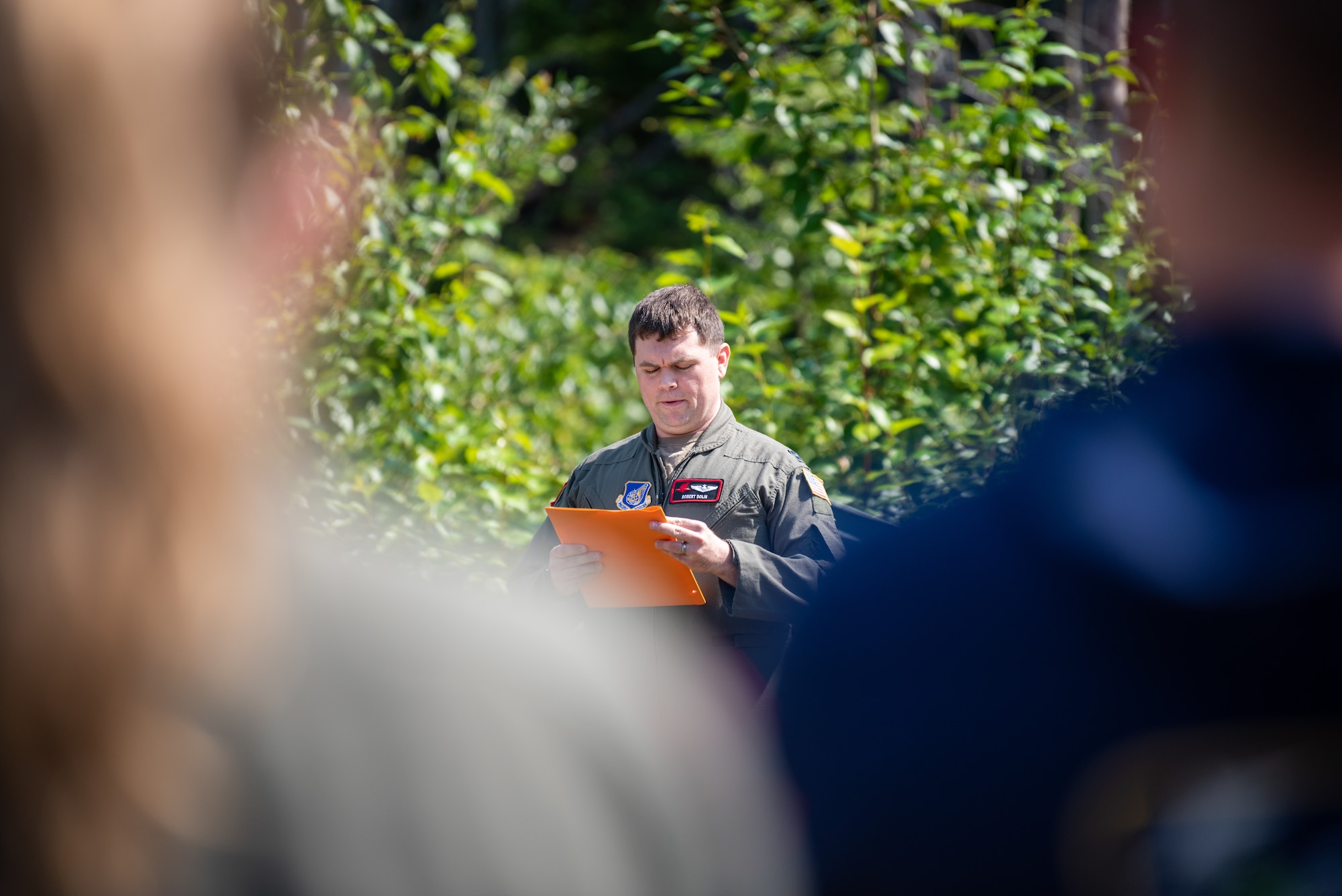 U.S. Air Force Capt. Robert Dolin, director of staff assigned to the 517th Airlift Squadron, conducts a final roll call ceremony at the crash site of “Sitka 43” at Joint Base Elmendorf-Richardson, Alaska.