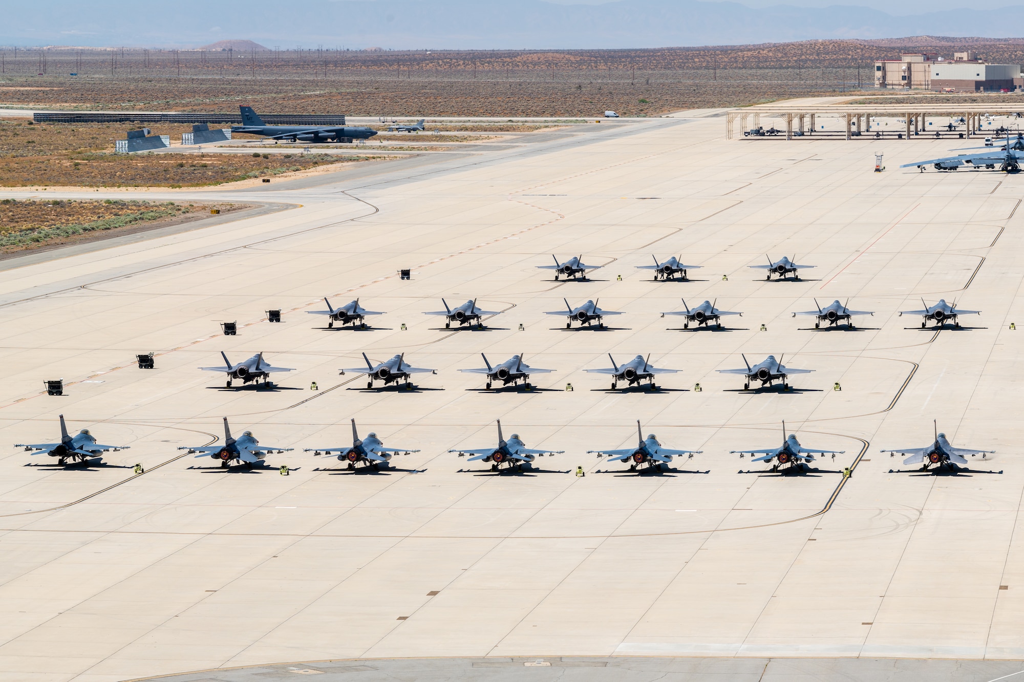 F-22s, F-35s, F-15s and F-16s assigned to the U.S. Air Force Weapons School park on the historic flightline at Edwards Air Force Base, California. The Weapons School provides academic and advisory support to numerous units, enhancing air combat training for thousands of Airmen from the Air Force, Department of Defense and U.S. allied services each year.