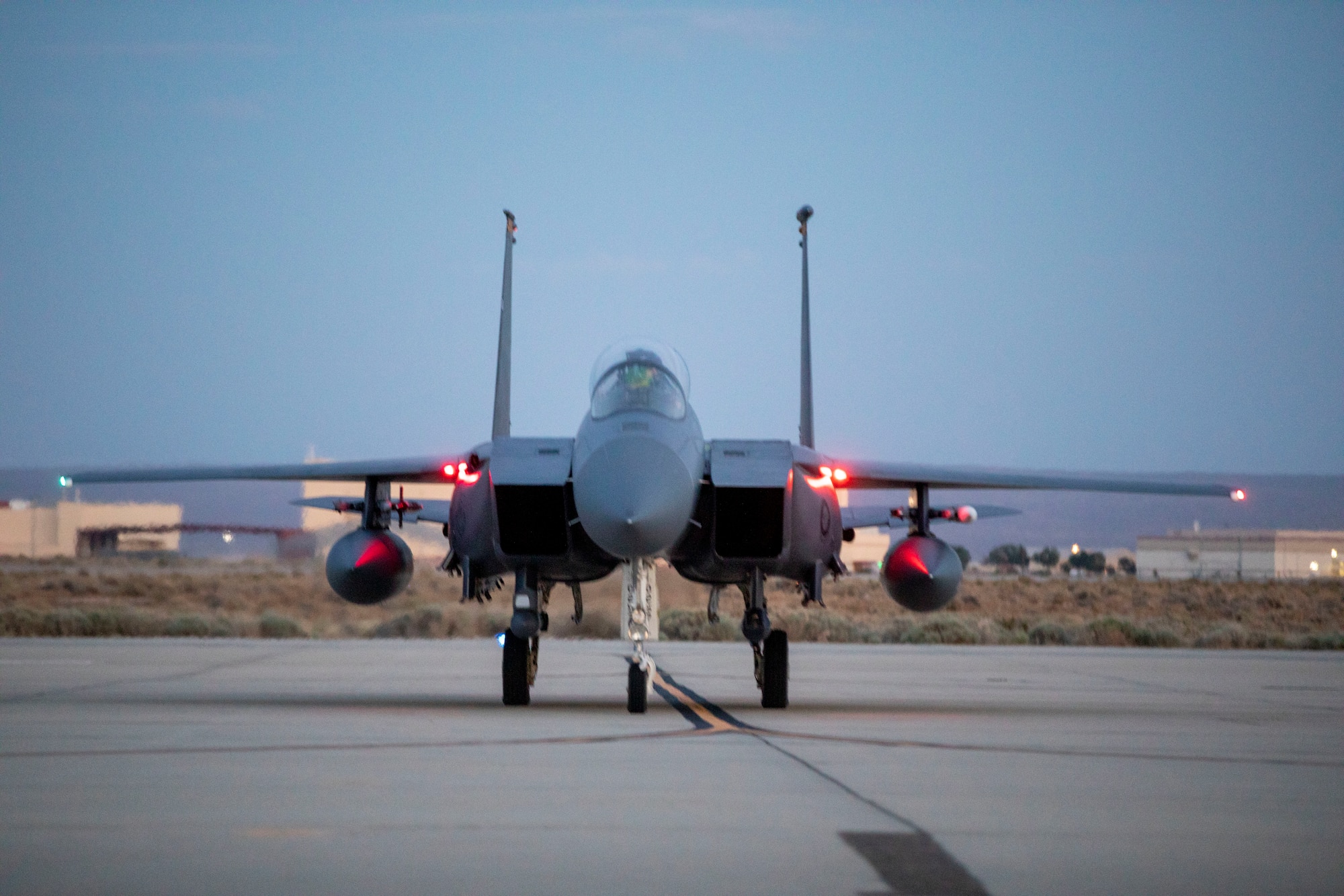 A F-15 assigned to the U.S. Air Force Weapons School parks on the flightline at Edwards Air Force Base, California. The Weapons School trains tactical experts and leaders to control and exploit air, space and cyber on behalf of the joint force.
