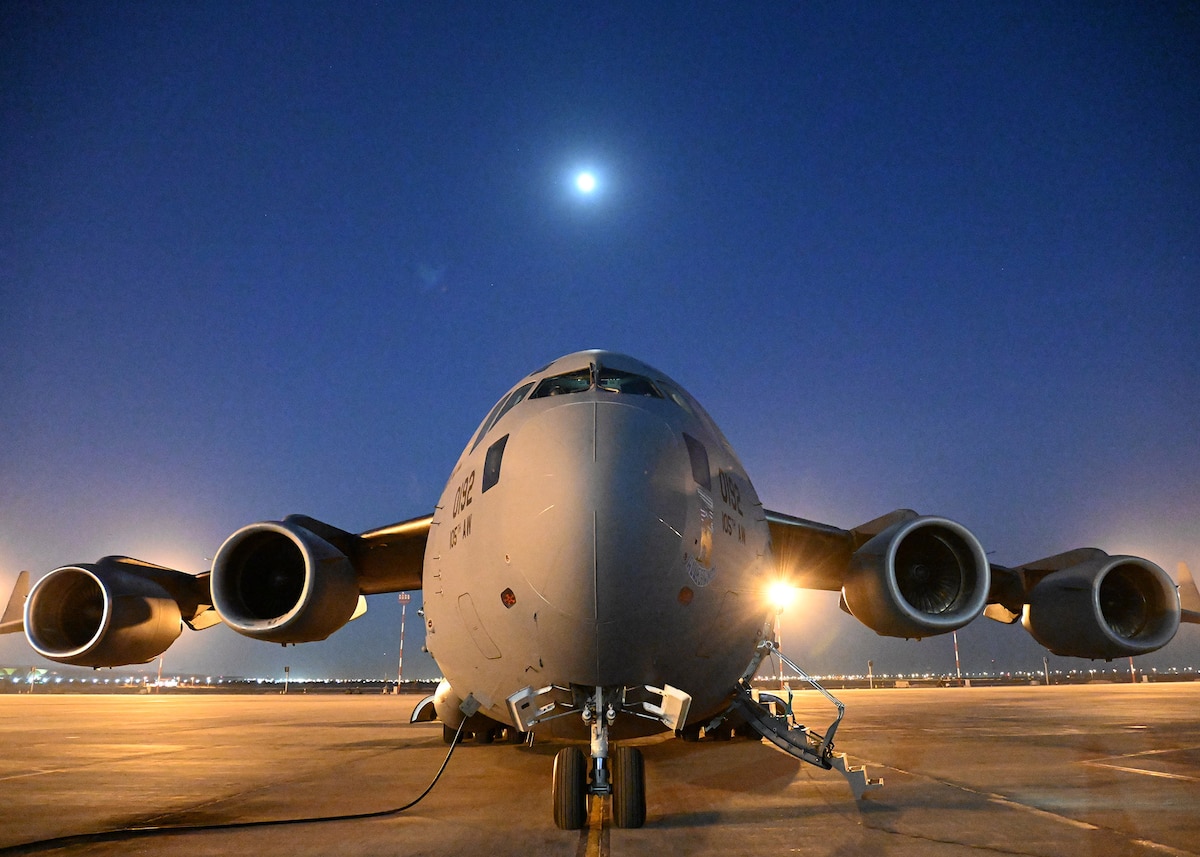 A C-17 Globemaster III from the 105th Airlift Wing sits on the ramp at Kuwait International Airport June 30, 2023. Seventeen Airmen from Stewart Air National Guard Base, Newburgh, N.Y., flew around the world carrying the 123rd Contingency Response Team in support of exercises Air Defender 23 and Mobility Guardian 23.