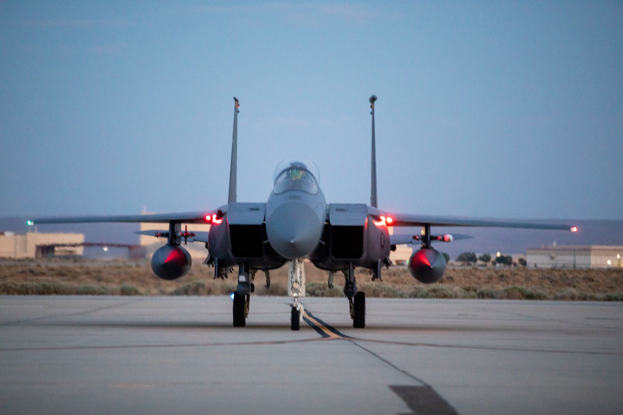 A F-15 assigned to the U.S. Air Force Weapons School parks on the flightline at Edwards Air Force Base, California. The Weapons School trains tactical experts and leaders to control and exploit air, space and cyber on behalf of the joint force.