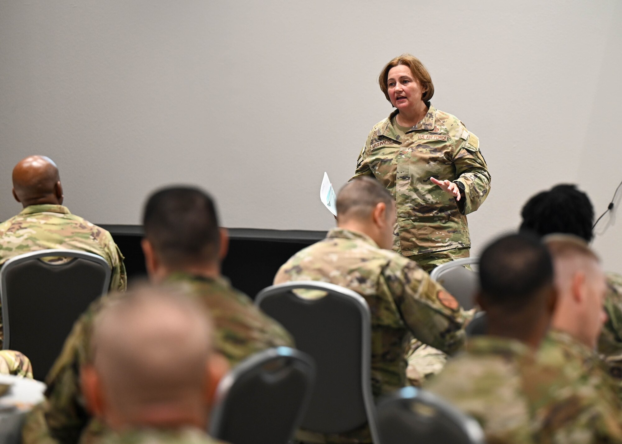 U.S. Air Force Col. Angelina Maguiness, 17th Training Wing commander, speaks during the Senior Leader Summit at the Powel Event Center, Goodfellow Air Force Base, Texas, July 26, 2023. The leaders discussed the importance of supporting young Airmen’s core pillars and shared perspectives on how to implement new outlets for students and permanent party to thrive mentally and physically. (U.S. Air Force Photo by Airman 1st Class Zach Heimbuch)