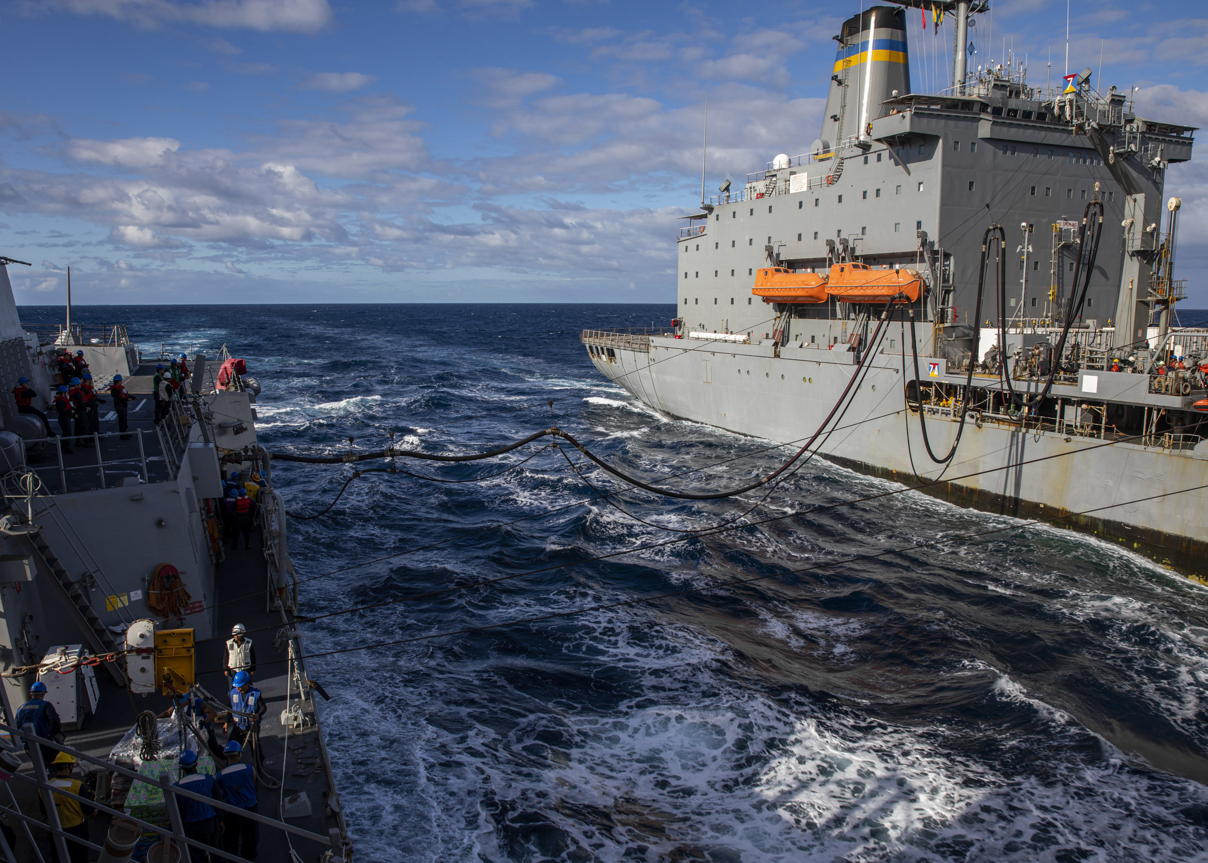 USS Rafael Peralta (DDG 115) conducts a replenishment-at-sea with the Military Sealift Command fleet replenishment oiler USNS Tippecanoe (T-AO 199).