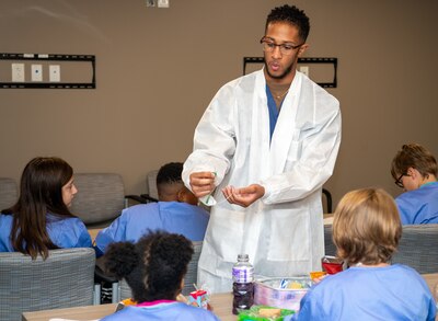 Hospitalman R’Jai Johnson, from clinical lab sciences, explains needle safety and the breadth of phlebotomy to elementary school students from Starbase Victory MedBase summer camp July 26 at Naval Medical Center Portsmouth (NMCP). The tour was part of an effort by the school district to expose children to the world of STEM. (U.S. Navy photo by Mass Communication Specialist 2nd Class Dylan M. Kinee)
