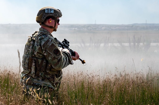  Man looks into distance in defensive position.