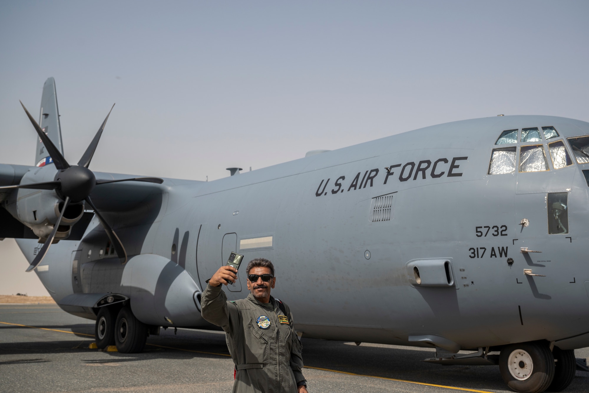 U.S. Air Force C-130J Super Hercules pilots with the 40th Expeditionary Airlift Squadron perform an airdrop demonstration flight with Kuwait Air Force pilots at Ali Al Salem Air Base, Kuwait, May 22, 2023. Partner nation integration opportunities foster and strengthen enduring relationships with coalition partners.