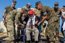 U.S. Air Force Lt. Gen. Ricky N. Rupp, commanding general of U.S. Forces Japan, and Brig. Gen. Adam Chalkley, the commanding general of 3rd Marine Logistics Group, escort a Battle of Iwo Jima veteran atop Mt. Suribachi after the 78th Reunion of Honor ceremony, Iwo To, Japan, March 25, 2023. The Reunion of Honor ceremony is held annually to bring together leaders from the U.S. and Japan, veterans, distinguished guests, and their family members to pay tribute to service members lost during the Battle of Iwo Jima, and is a testament to the ironclad U.S.-Japan alliance which has blossomed over the past 78 years. (U.S. Marine Corps photo by Lance Cpl. Federico Marquez)