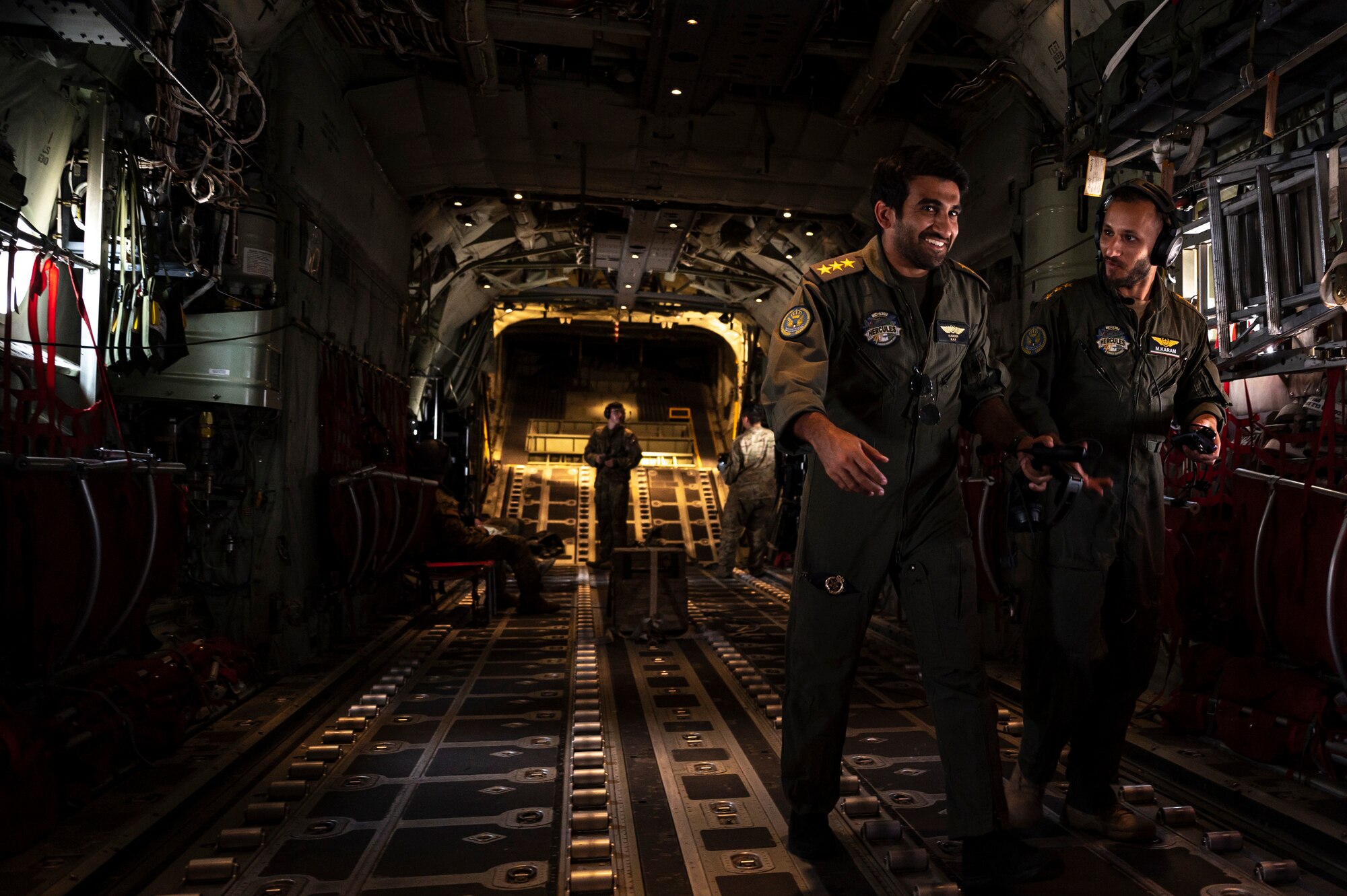 U.S. Air Force C-130J Super Hercules pilots with the 40th Expeditionary Airlift Squadron perform an airdrop demonstration flight with Kuwait Air Force pilots at Ali Al Salem Air Base, Kuwait, May 22, 2023. Partner nation integration opportunities foster and strengthen enduring relationships with coalition partners.