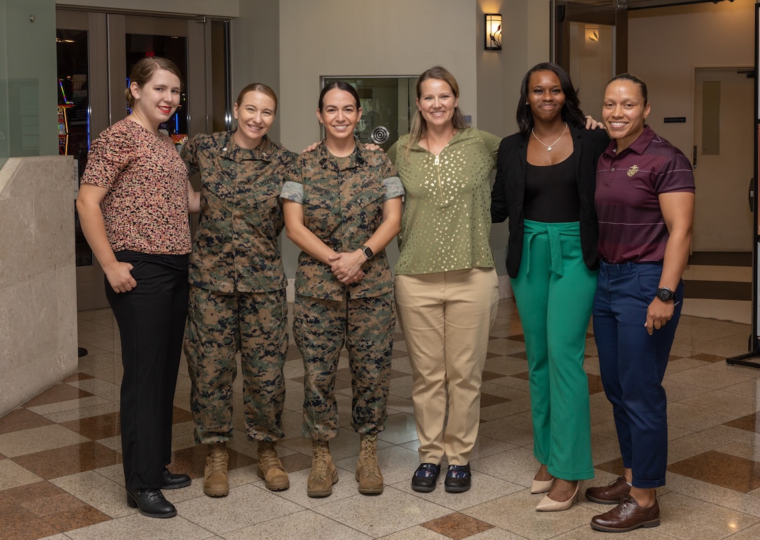 U.S. Marines and civilians from across III Marine Expeditionary Force (MEF), pose for a group photo during a Women in Uniform Symposium at Camp Foster, Okinawa, Japan, April 6, 2023. The Women in Uniform Symposium focused on promoting empowerment and growth amongst active duty service members in Okinawa through guided discussions and workshops. (U.S. Marine Corps photo by Lance Cpl. Sydni Jessee)