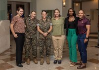 U.S. Marines and civilians from across III Marine Expeditionary Force (MEF), pose for a group photo during a Women in Uniform Symposium at Camp Foster, Okinawa, Japan, April 6, 2023. The Women in Uniform Symposium focused on promoting empowerment and growth amongst active duty service members in Okinawa through guided discussions and workshops. (U.S. Marine Corps photo by Lance Cpl. Sydni Jessee)