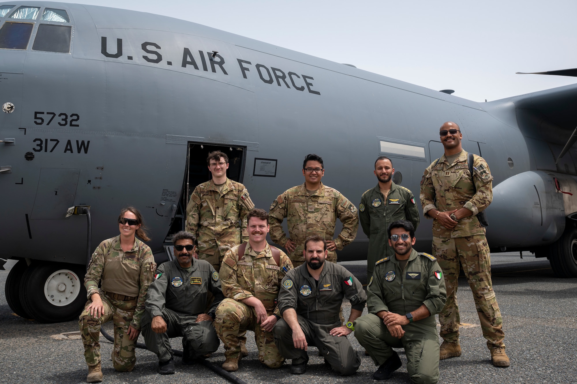 U.S. Air Force C-130J Super Hercules pilots with the 40th Expeditionary Airlift Squadron perform an airdrop demonstration flight with Kuwait Air Force pilots at Ali Al Salem Air Base, Kuwait, May 22, 2023. Partner nation integration opportunities foster and strengthen enduring relationships with coalition partners.