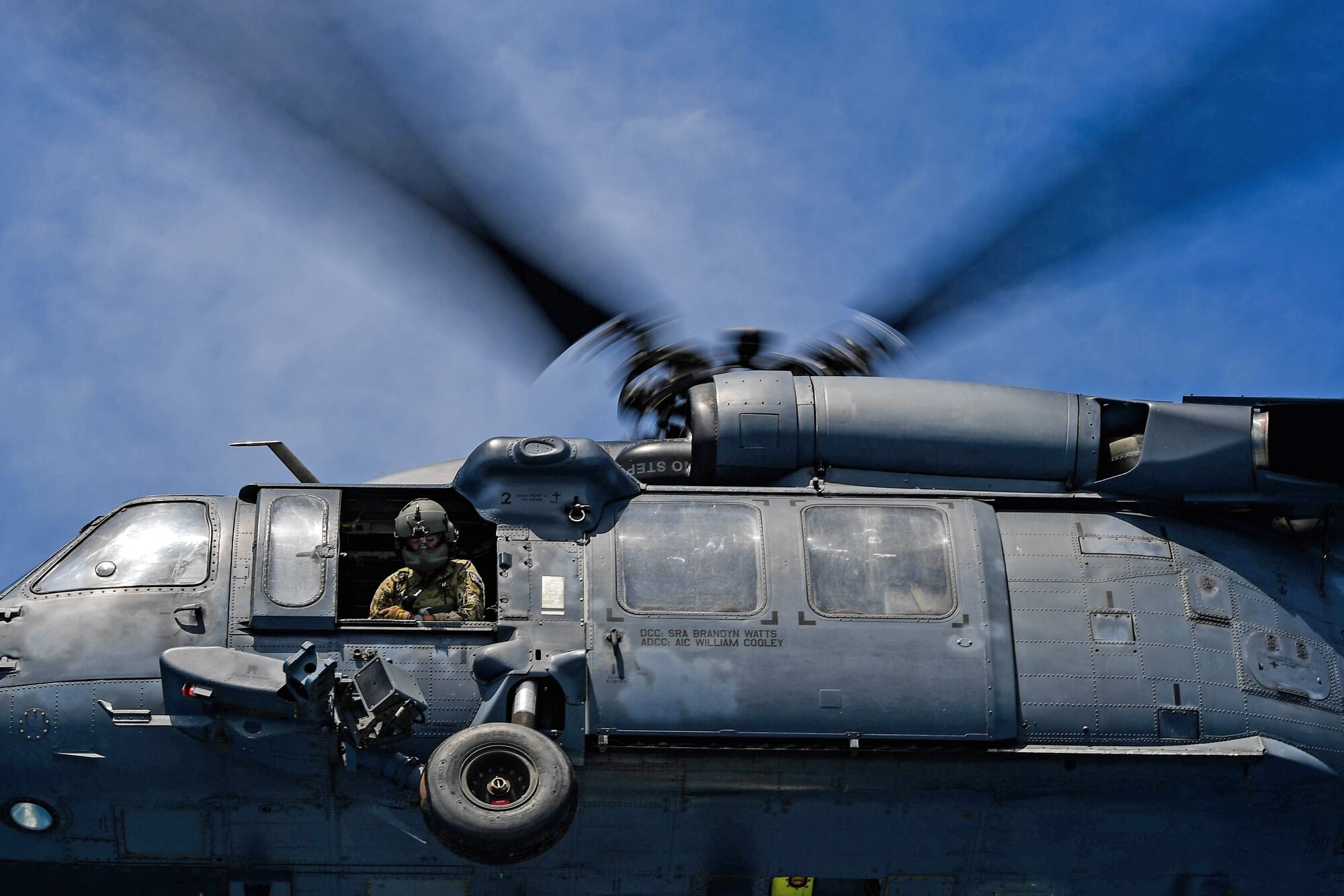 A Special Missions Aviator assigned to the 55th Rescue Squadron prepares to perform underway training with the 57th RQS aboard an Albanian navy ship during exercise Astral Knight 2023 off the coast of Albania May 19, 2023. AK23 allows allied forces to perform in a collaborative partnership that improves interoperability in small unit ground tactics, command and control, technical rescue, incident site management, tactical medicine and personnel recovery. (U.S. Air Force photo by Senior Airman Noah Sudolcan)