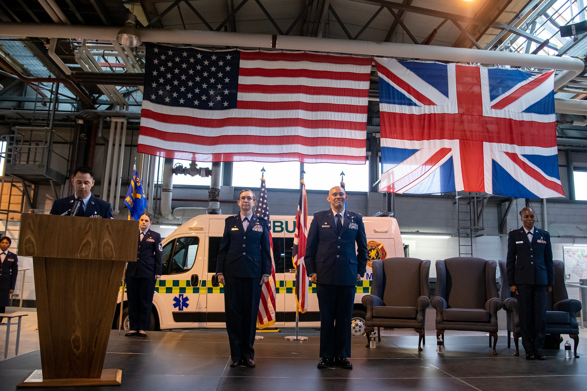 Members of the 501st Combat Support Wing stand at attention during a decoration reading at RAF Alconbury, England, May 30, 2023. The decoration was read as part of the 423d Medical Squadron change of command ceremony where Lt. Col. Darrell Lee relinquished command of the 423d MDS to Lt. Col. Yvonne Storey. (U.S. Air Force photo by Staff Sgt. Eugene Oliver)