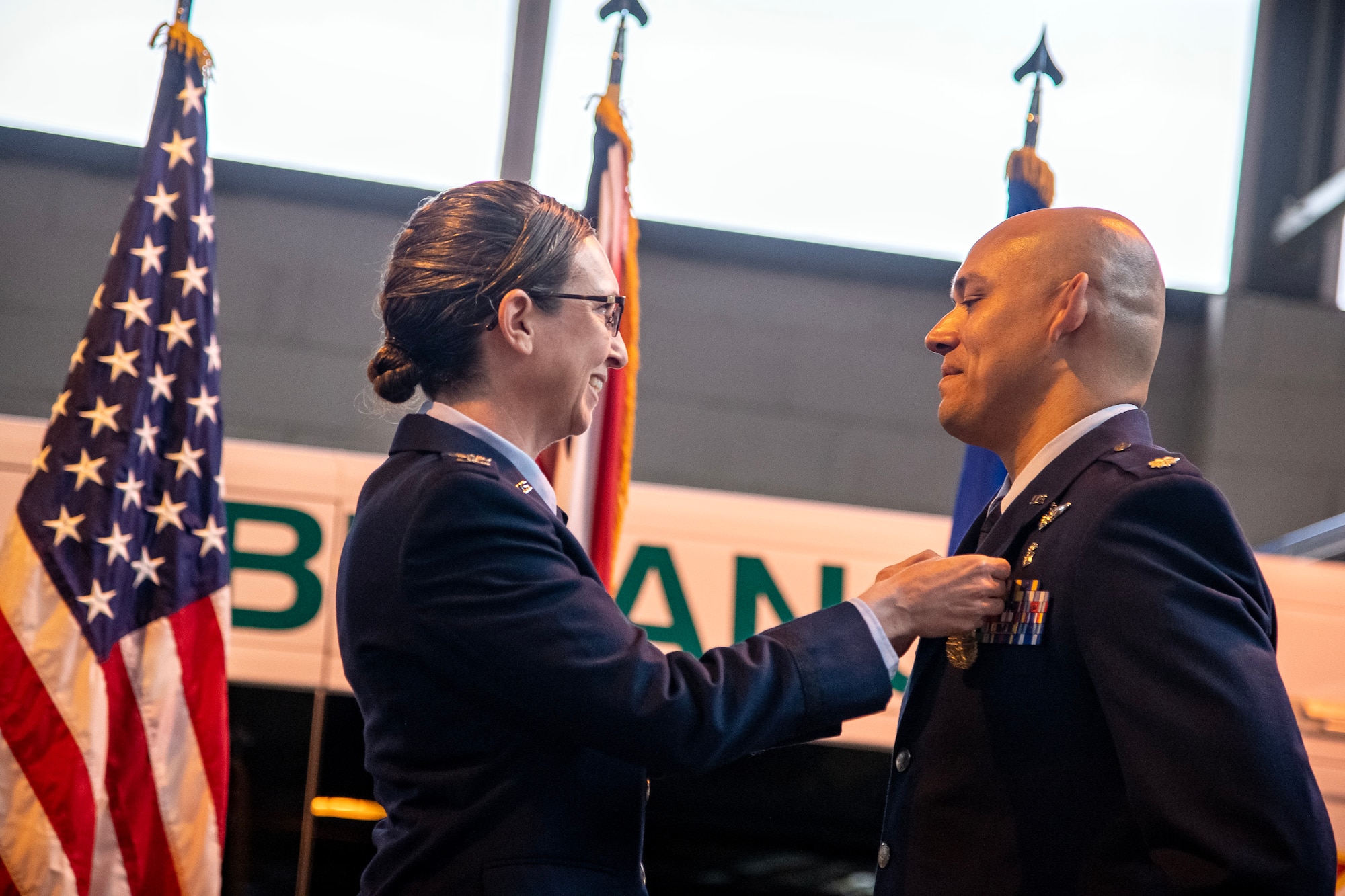 U.S. Air Force Col. Valerie Long, left, 423d Air Base Group commander, pins a meritorious service medal on Lt. Col. Darrell Lee, 423d Medical Squadron outgoing commander, at RAF Alconbury, England, May 30, 2023. During his command, Lee was responsible for the delivery of comprehensive medical, nursing, mental health and dental services supporting 12 multi-service, multi-national and interagency mission partners. (U.S. Air Force photo by Staff Sgt. Eugene Oliver)