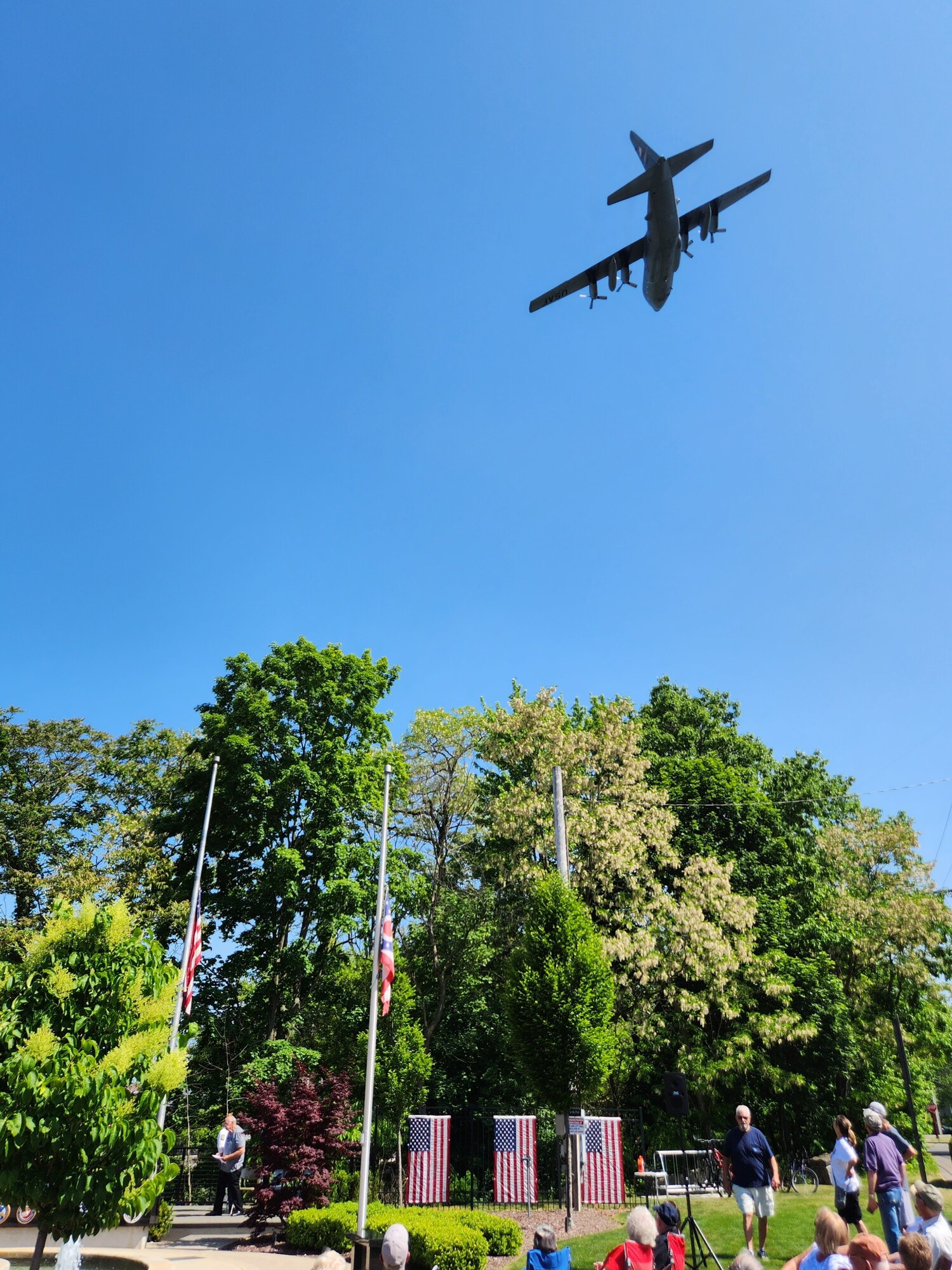 910th Airlift Wing aircrew members perform a flyover in one of the wing’s C-130H Hercules tactical cargo aircraft to mark the start of the Cortland Memorial Day ceremony at the veterans memorial here, May 29, 2023.