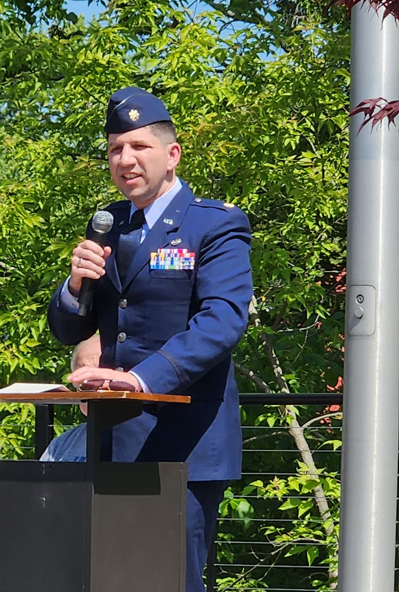 Maj. Nathanael Okhuysen, an active-duty Air Force Staff Judge Advocate attached to the 910th Airlift Wing staff, speaks at the Cortland Memorial Day ceremony at the veterans memorial here, May 29, 2023.